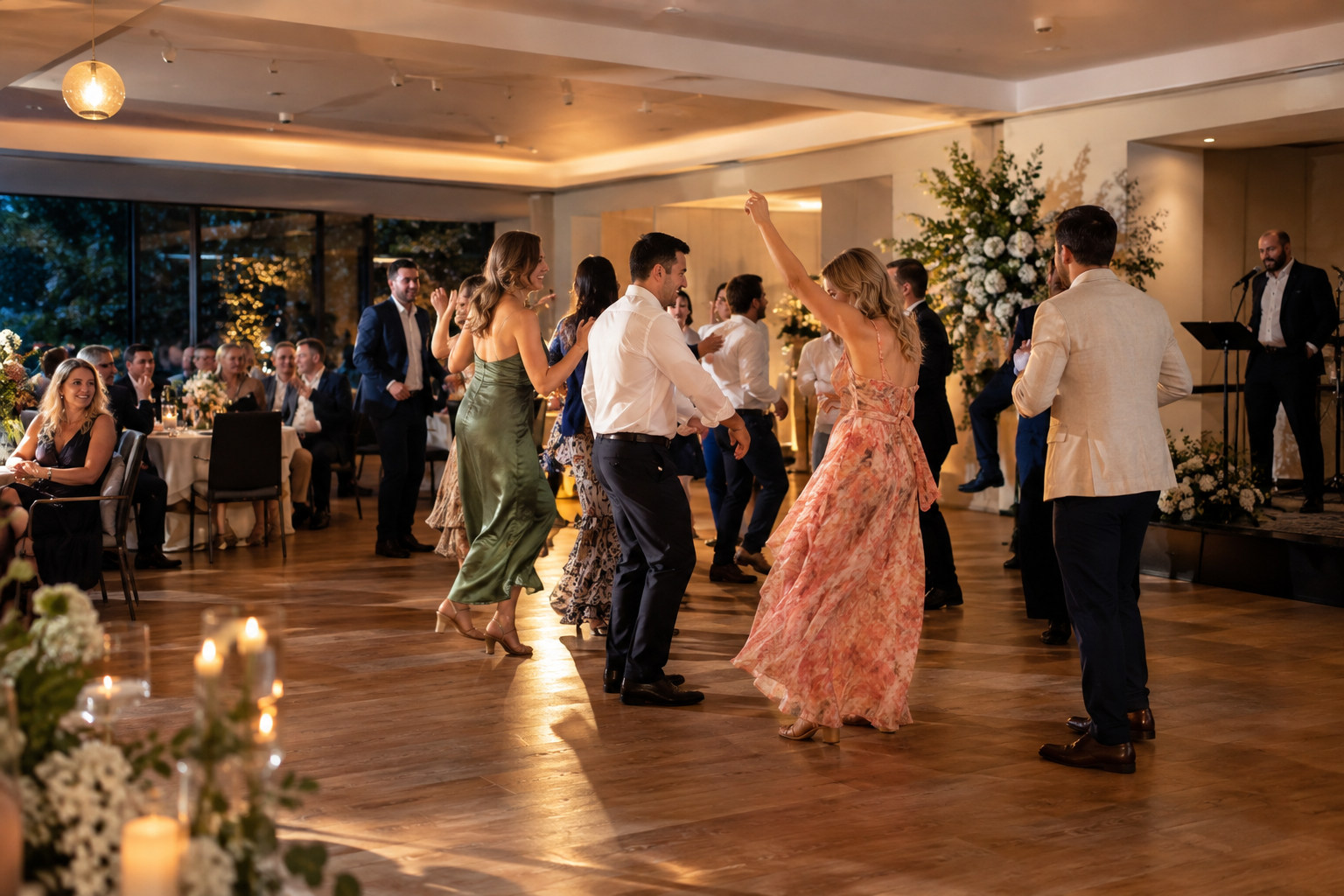 Guests dancing in a spacious birthday function room